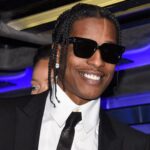 A$AP Rocky gebruikt vrouw als opstapje om over hek te klimmen